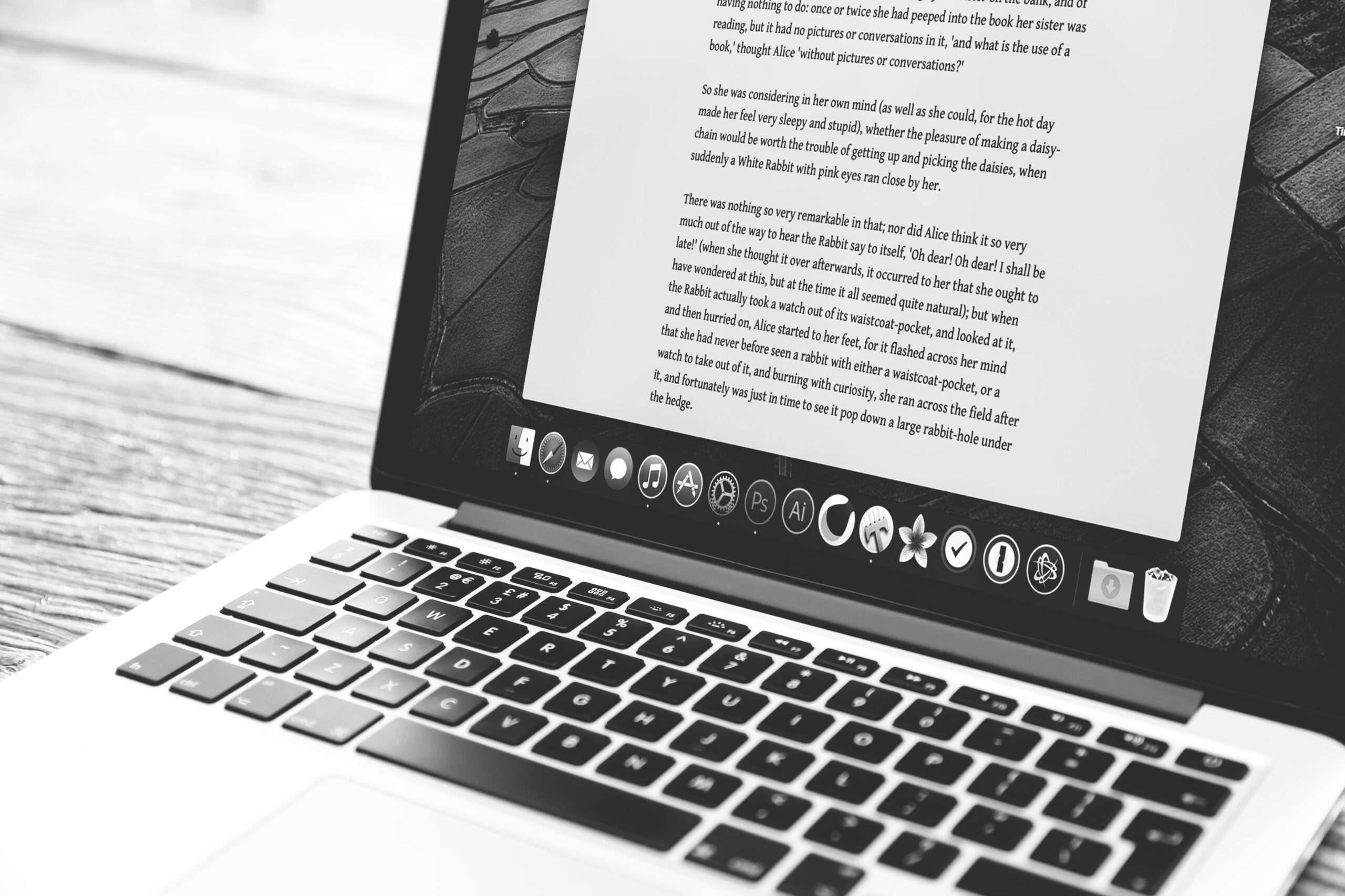 A UK content writer creating web content on a laptop.